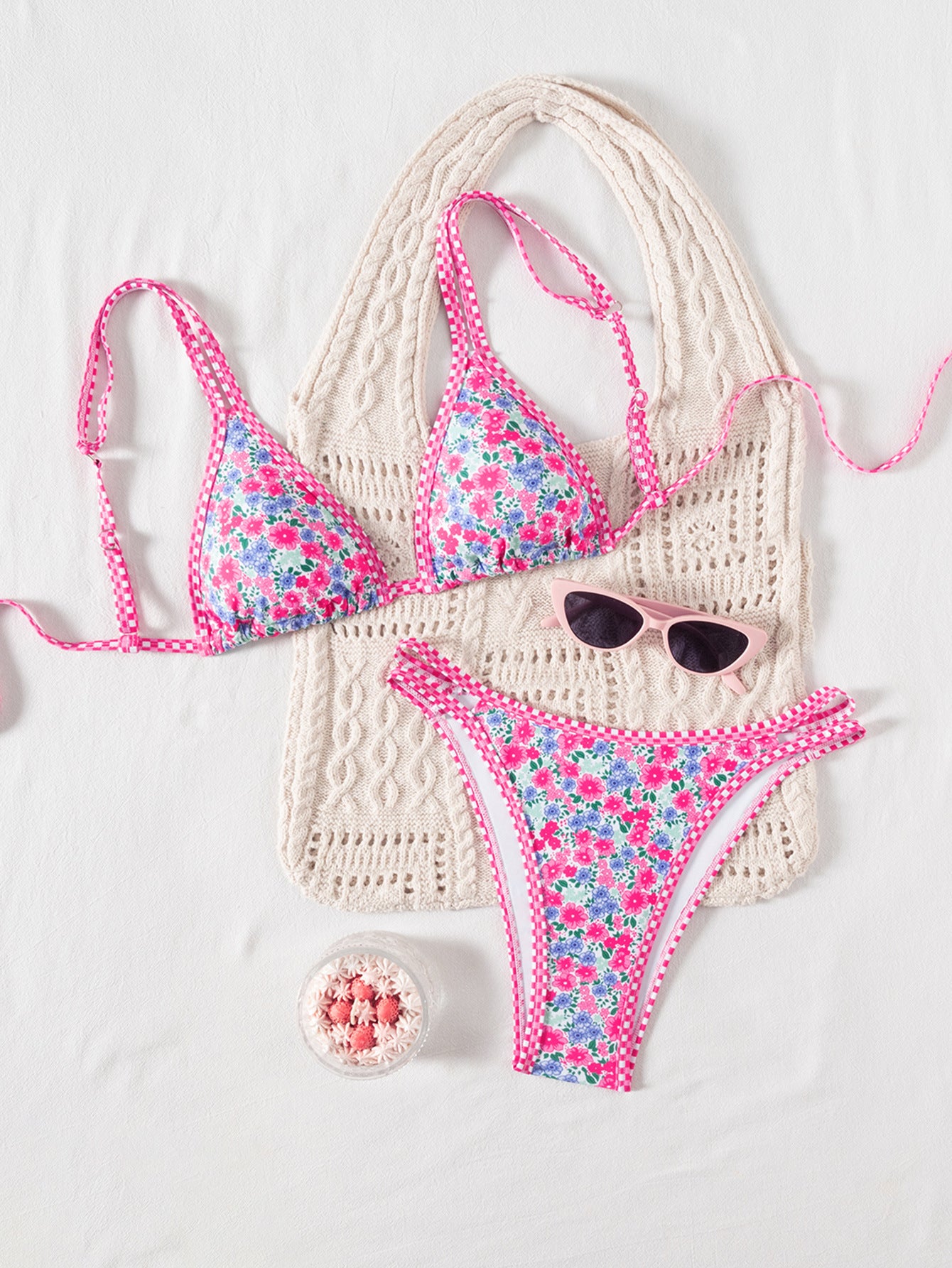 Floral bikini set with crochet details on a white background