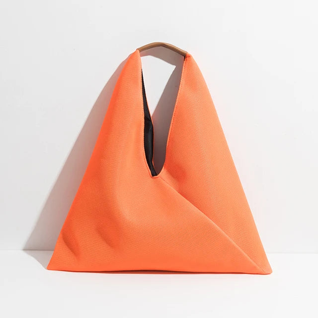 Orange tote bag on a light gray background