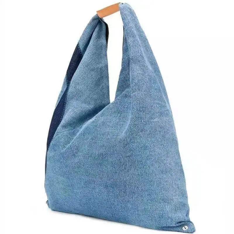 Blue denim-style bag on a white background