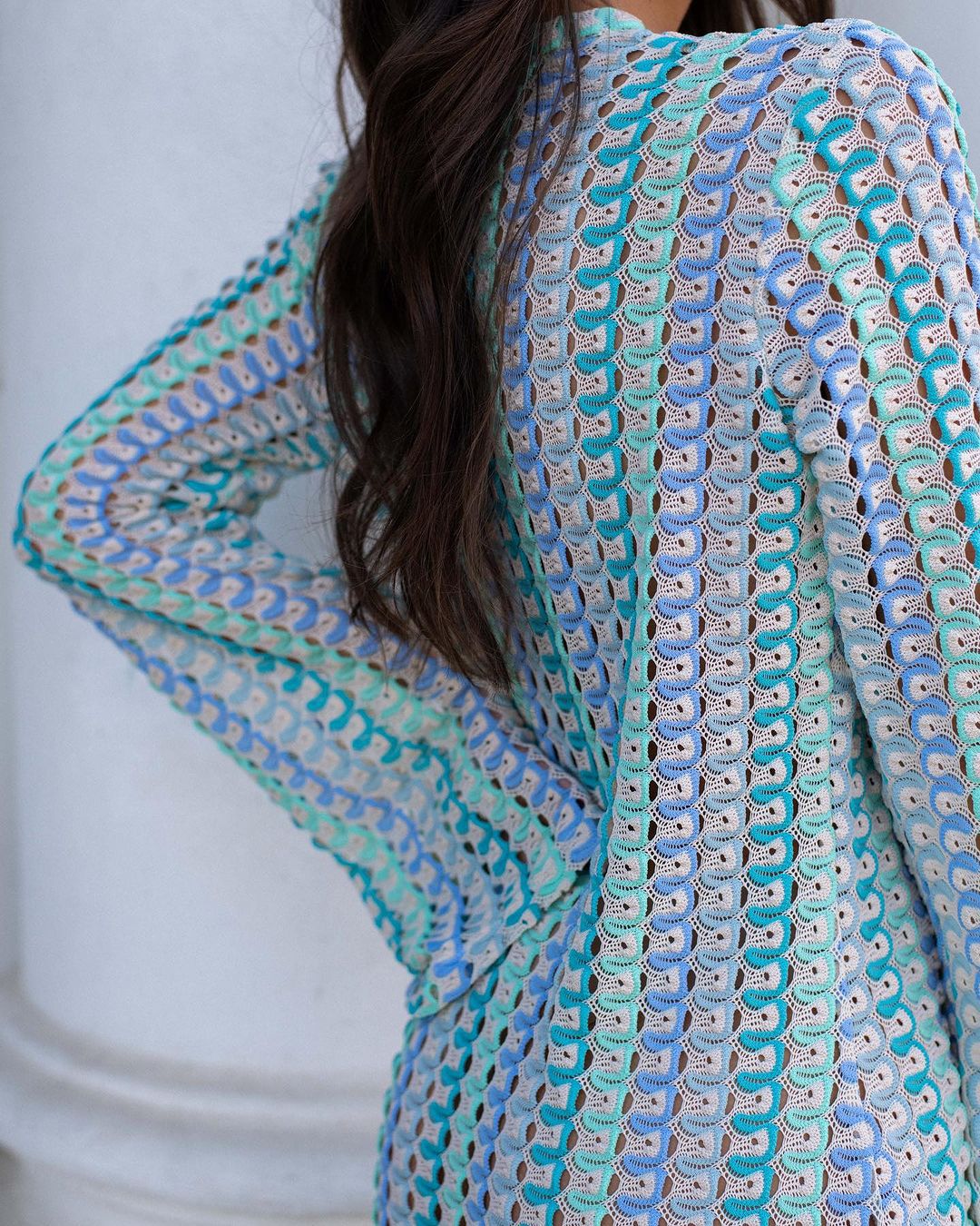 Patterned fabric with a blue and green design on a white background